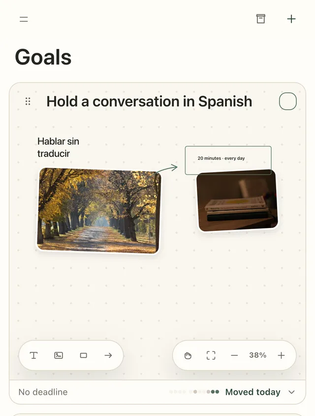 A goal board on an iPhone: a title, two photos, a handwritten note, a framed note and an arrow, with the toolbar at the bottom.